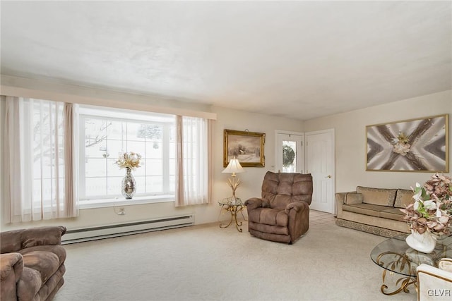 living room featuring light colored carpet and a baseboard heating unit