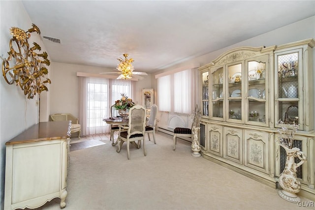 dining room featuring light colored carpet