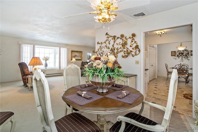 dining room with baseboard heating and ceiling fan