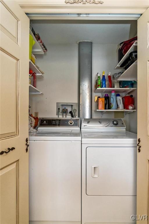 clothes washing area with washer and dryer