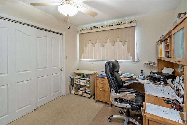 carpeted home office with ceiling fan