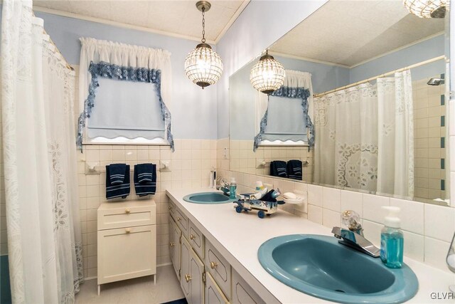 bathroom featuring vanity, ornamental molding, walk in shower, and tasteful backsplash