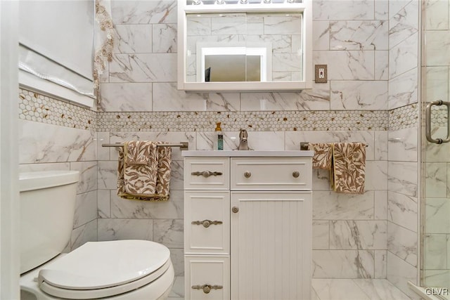 bathroom with a shower with door, tile walls, and toilet