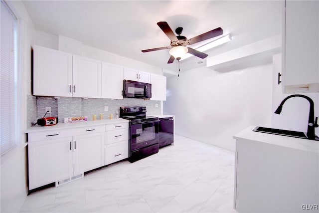 kitchen featuring backsplash, white cabinetry, ceiling fan, and black appliances