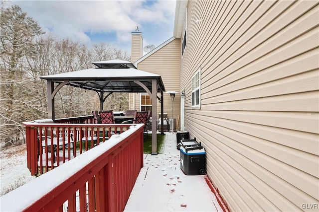 snow covered deck featuring a gazebo