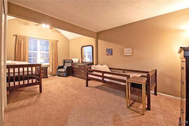 carpeted bedroom featuring lofted ceiling