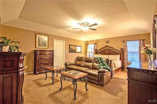 bedroom with light carpet, a ceiling fan, and baseboards