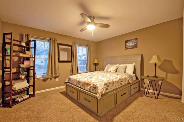 bedroom with a ceiling fan, light colored carpet, and baseboards