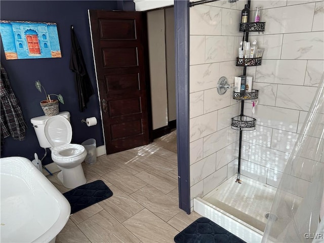 bathroom with toilet and separate shower and tub