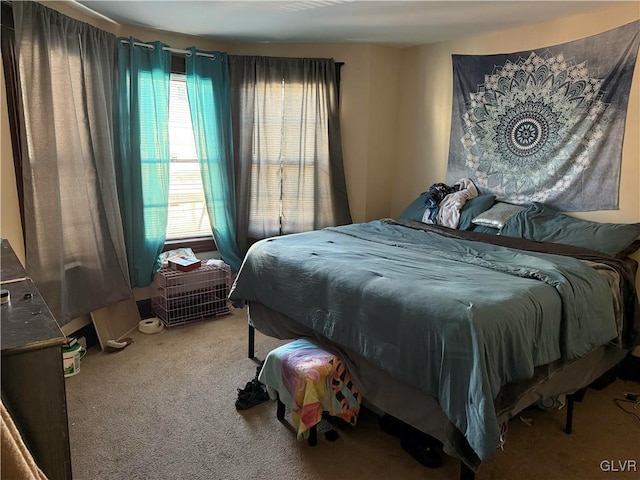 bedroom with carpet and multiple windows