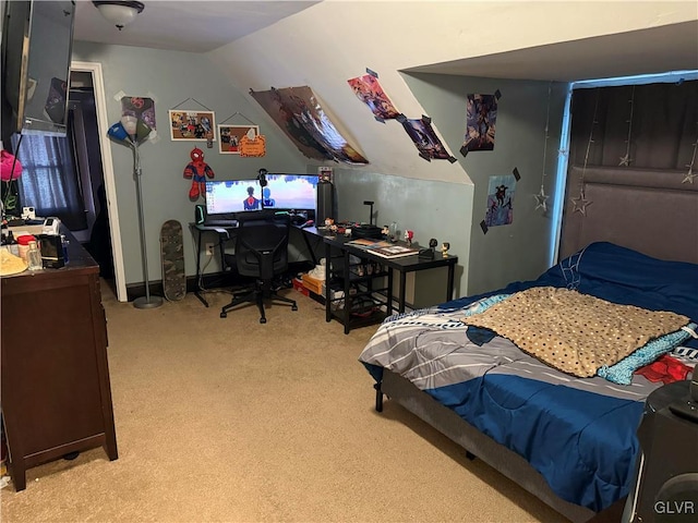 bedroom with light colored carpet, a closet, and lofted ceiling