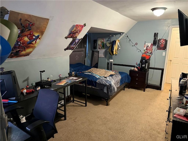 carpeted bedroom featuring vaulted ceiling