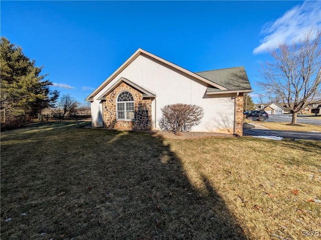 view of property exterior featuring a lawn