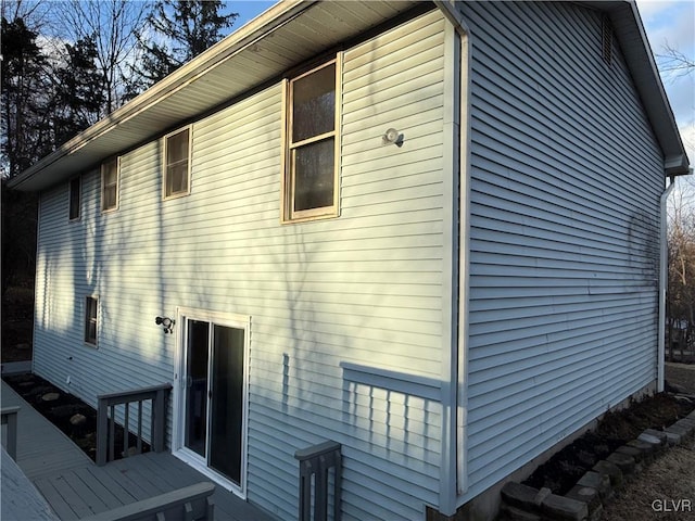 view of side of home featuring a deck