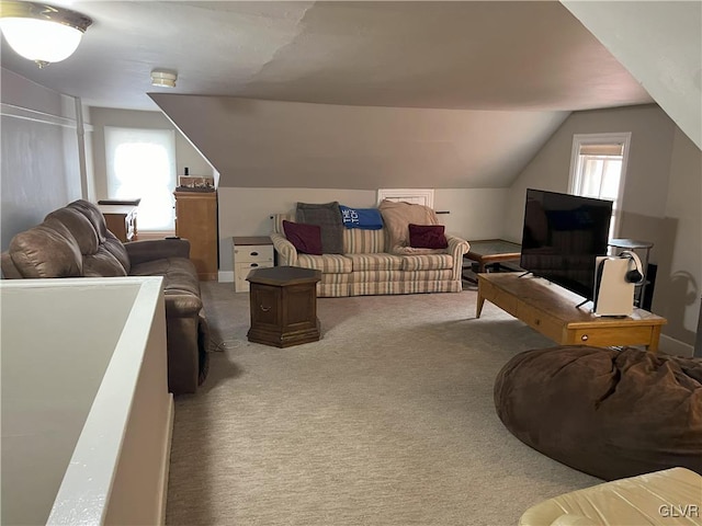 living room with carpet and lofted ceiling