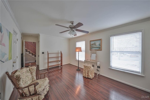 sitting room with crown molding, plenty of natural light, and ceiling fan