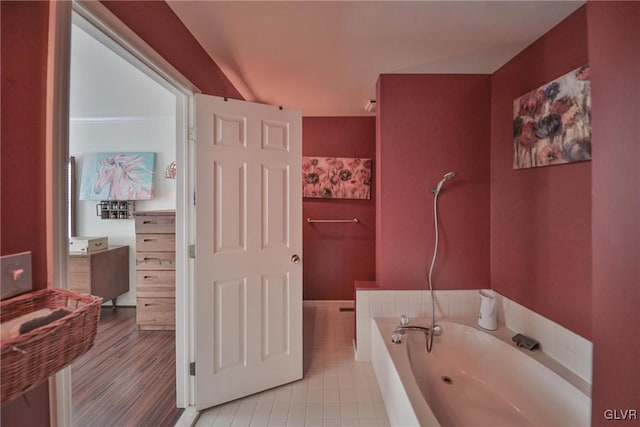 bathroom with a bathing tub and vanity