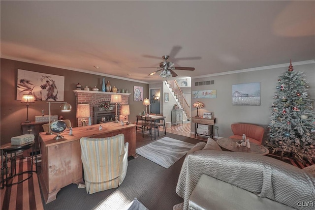 living room with a fireplace, ceiling fan, and ornamental molding