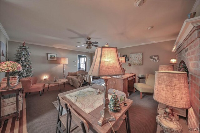 living room with dark carpet, ceiling fan, and crown molding