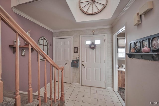 tiled entrance foyer with crown molding