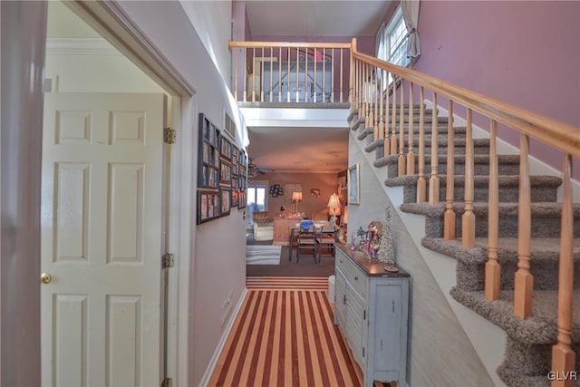 stairway featuring crown molding