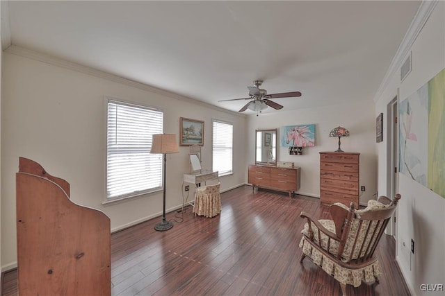 sitting room with ceiling fan, crown molding, and dark hardwood / wood-style floors