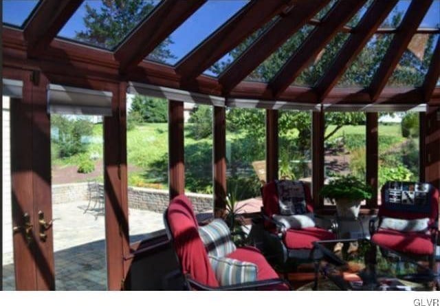 sunroom / solarium with lofted ceiling