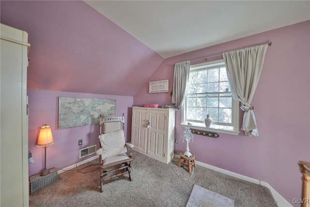 living area featuring carpet and lofted ceiling