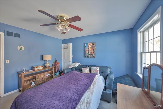 carpeted bedroom featuring ceiling fan