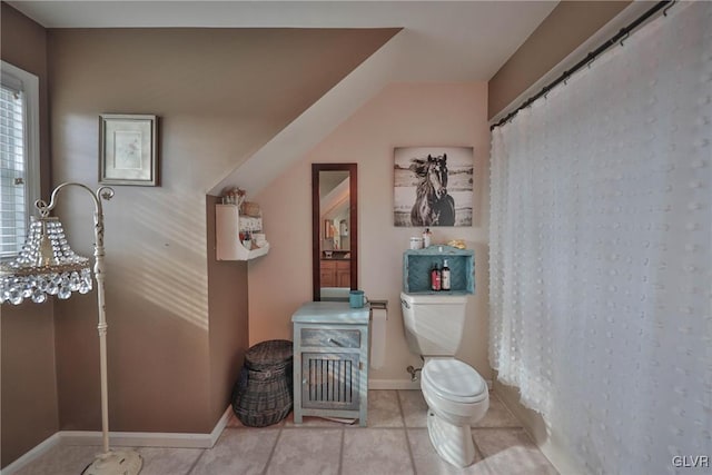 bathroom featuring tile patterned flooring and toilet