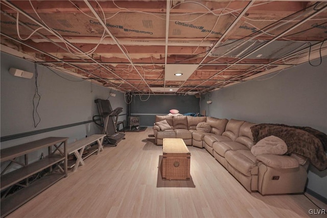 basement with hardwood / wood-style floors