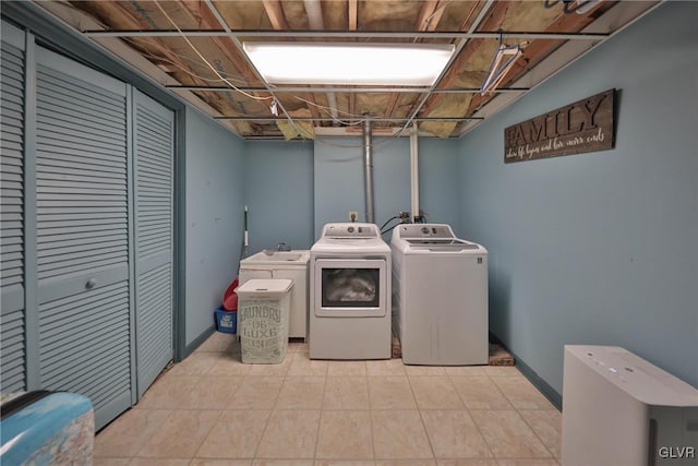 clothes washing area featuring washer and dryer