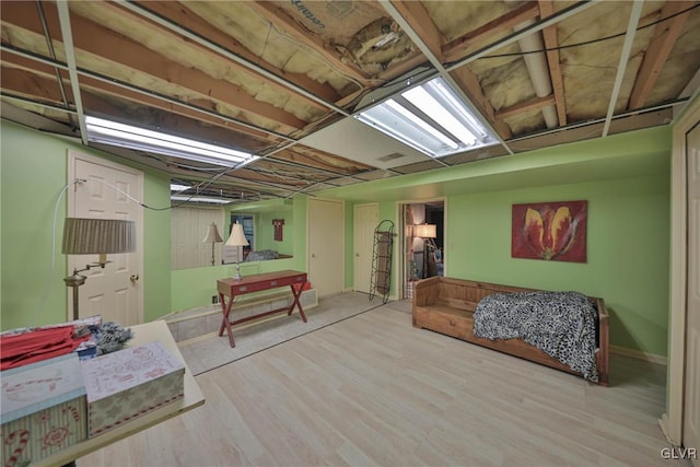 basement featuring hardwood / wood-style floors