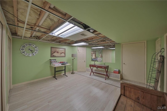 basement featuring light hardwood / wood-style floors