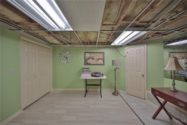 basement featuring light hardwood / wood-style floors