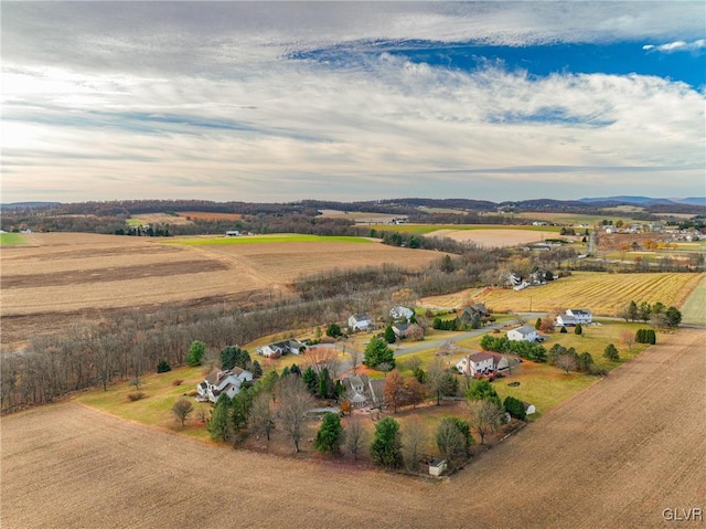 birds eye view of property with a rural view