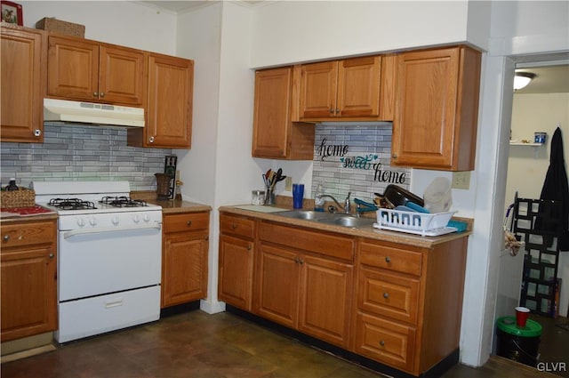 kitchen featuring sink, white gas range oven, and tasteful backsplash