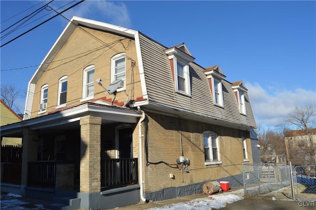 view of side of property featuring a porch