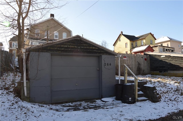 view of snow covered garage