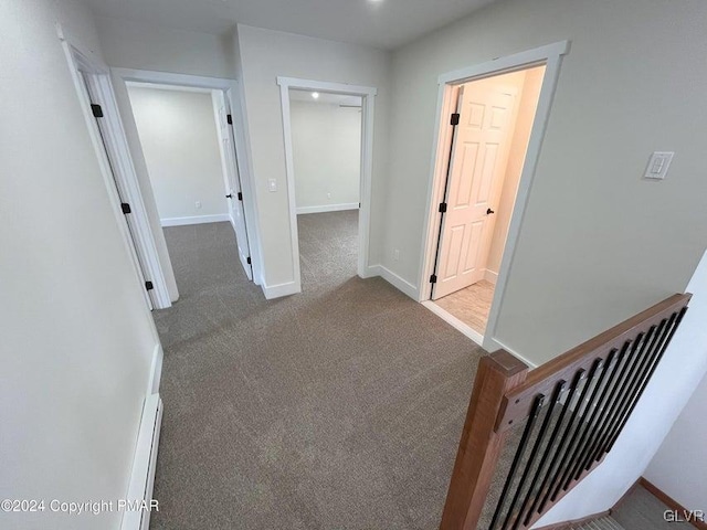 hallway with carpet floors