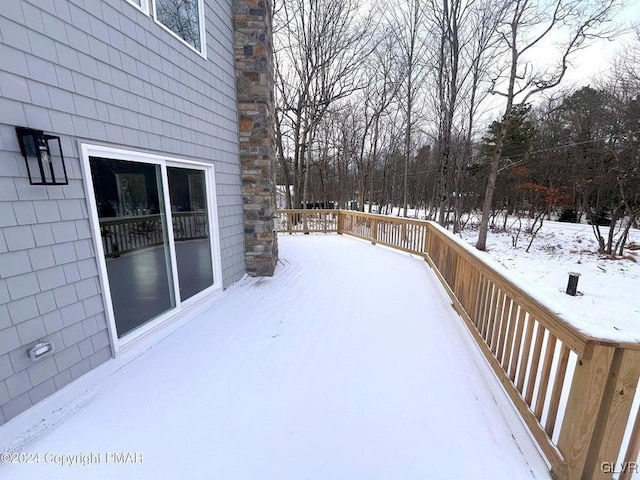 view of snow covered deck