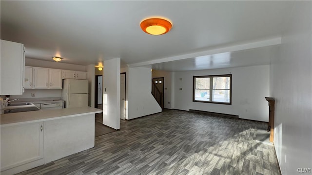 9860 Deerwood Dr, Coolbaugh Twp, PA 18466 - kitchen with white appliances, open floor plan, light countertops, white cabinets, and dark wood-style floors