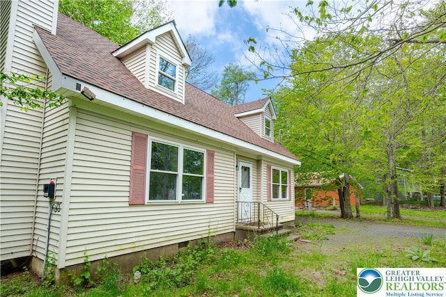 9860 Deerwood Dr, Coolbaugh Twp, PA 18466 - view of front facade with roof with shingles