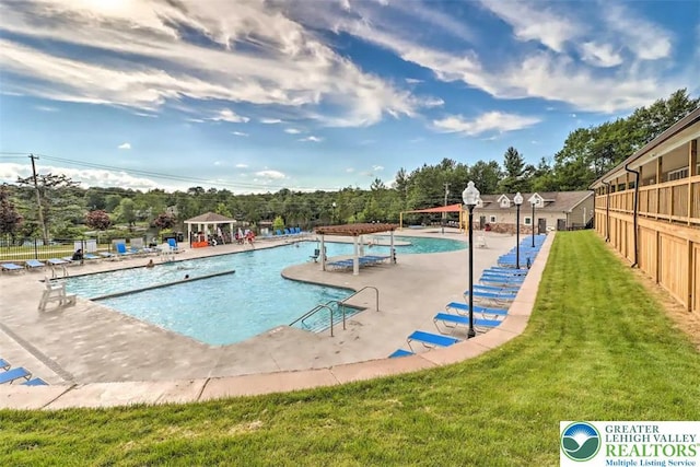 9860 Deerwood Dr, Coolbaugh Twp, PA 18466 - community pool featuring a gazebo and view of scattered trees