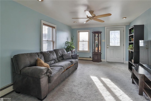 living room with carpet flooring, ceiling fan, and a baseboard radiator