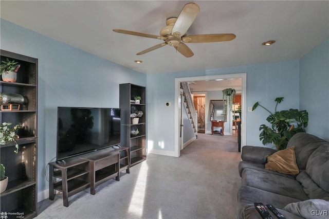 living room with ceiling fan and light carpet