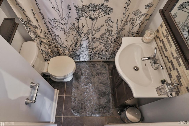 bathroom with tile patterned floors, toilet, and sink