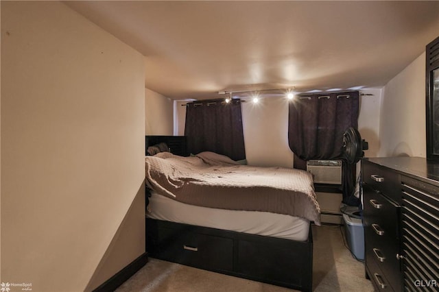 bedroom featuring light colored carpet