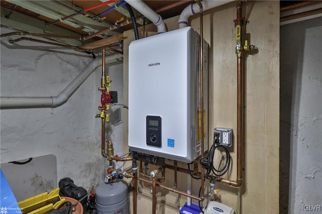 utility room featuring water heater