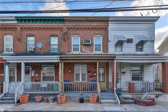 multi unit property with cooling unit and a porch